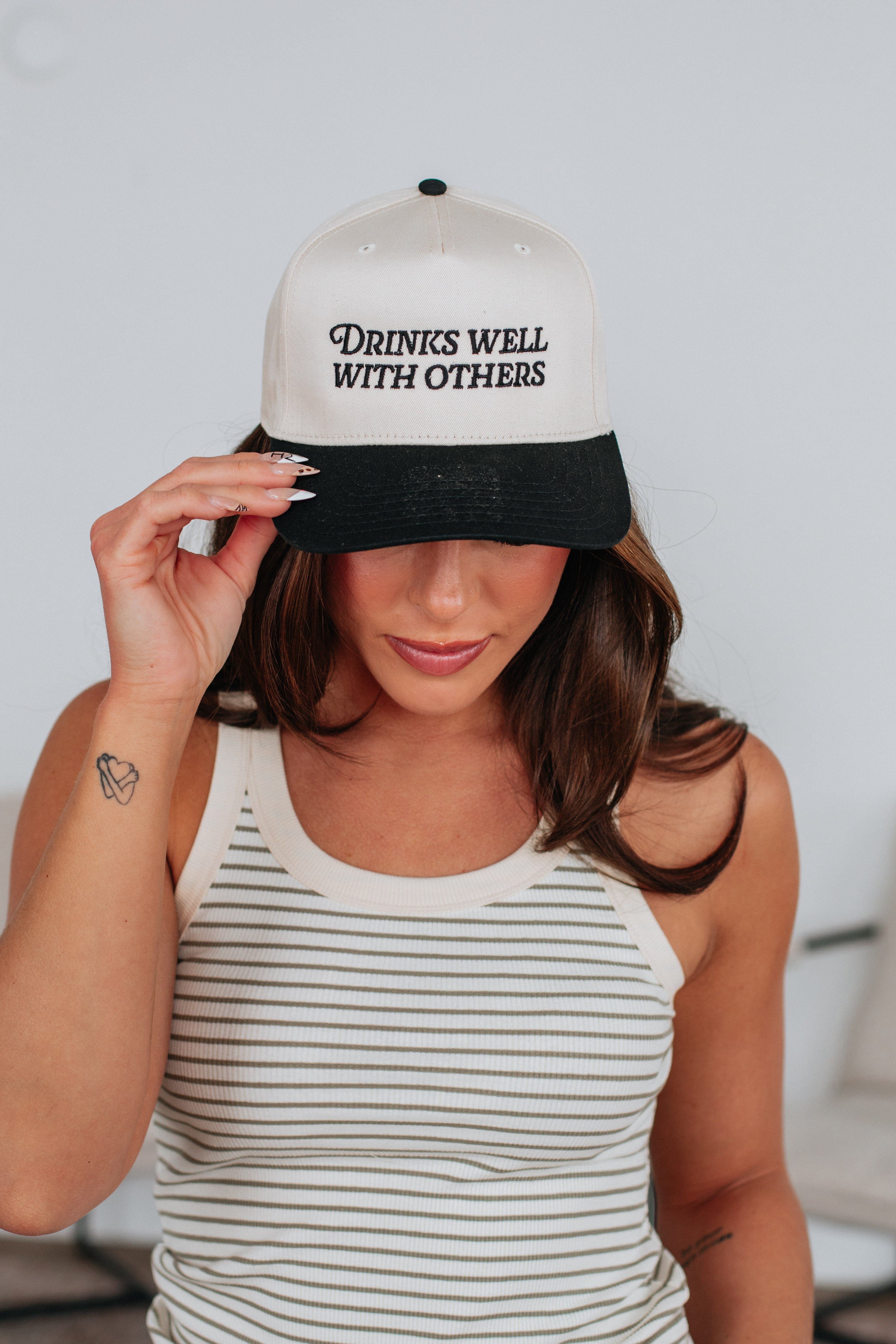 Drinks Well With Others Trucker Hat